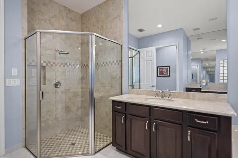 a bathroom with a tub and shower