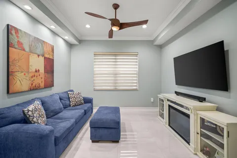 a view of a house with swimming pool and sitting area