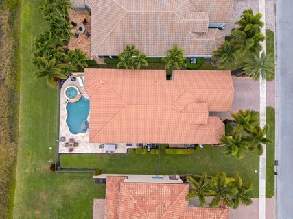 a view of swimming pool with outdoor seating and lake view