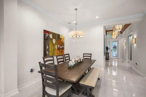 a kitchen with kitchen island granite countertop a sink stove and refrigerator