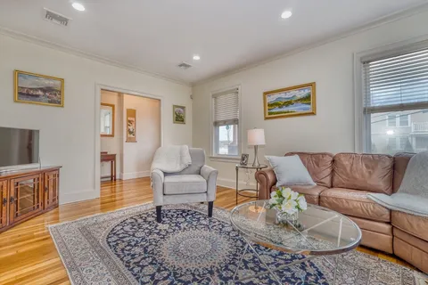 a living room with furniture and a rug