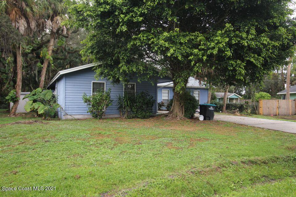 1495 Norbert Road Northeast Palm Bay, FL 32907 - Photo 1 of 10 a view of a house with backyard and sitting area