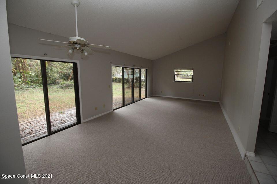 1495 Norbert Road Northeast Palm Bay, FL 32907 - Photo 5 of 10 a view of a livingroom with an empty space and a window