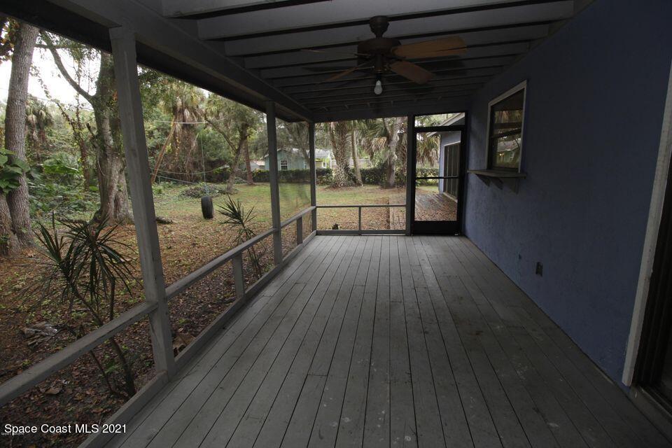 1495 Norbert Road Northeast Palm Bay, FL 32907 - Photo 9 of 10 a view of a porch with wooden floor and outdoor space