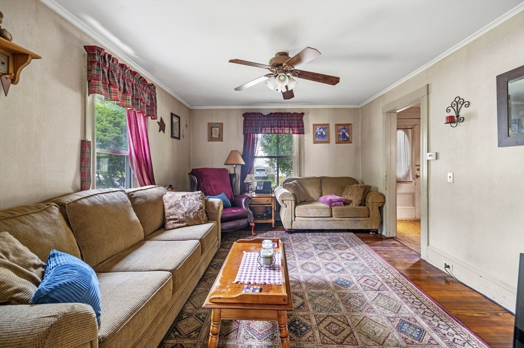 3 Trask Street Danvers, MA 01923 - Photo 12 of 29 a living room with furniture ceiling fan and a rug
