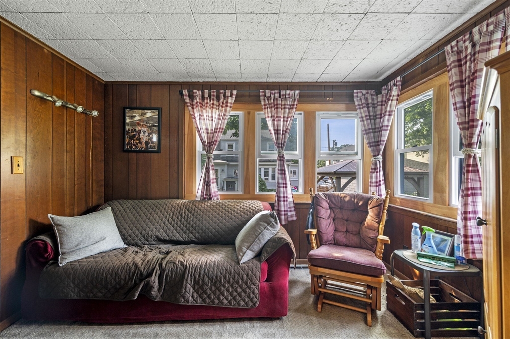 3 Trask Street Danvers, MA 01923 - Photo 17 of 29 a living room with furniture a large window and a flat screen tv