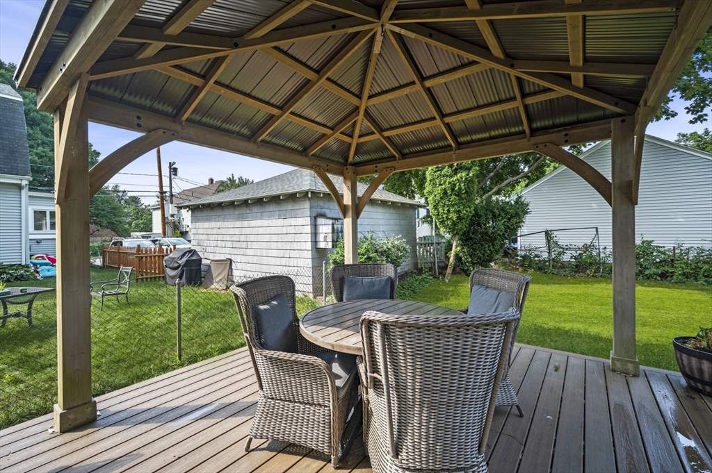 3 Trask Street Danvers, MA 01923 - Photo 2 of 29 a view of a chair and table on the deck