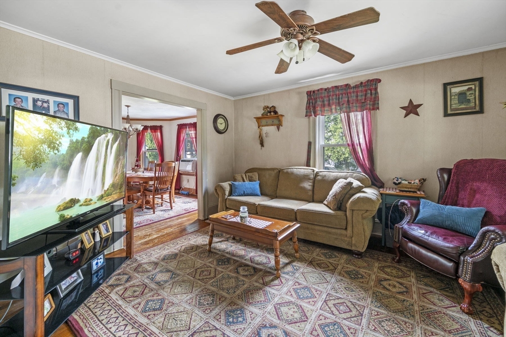 3 Trask Street Danvers, MA 01923 - Photo 4 of 29 a living room with furniture and a flat screen tv