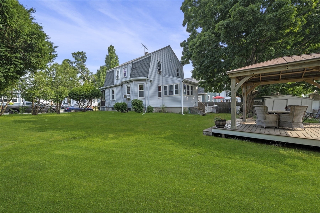 3 Trask Street Danvers, MA 01923 - Photo 8 of 29 a view of a house with a yard deck and sitting area