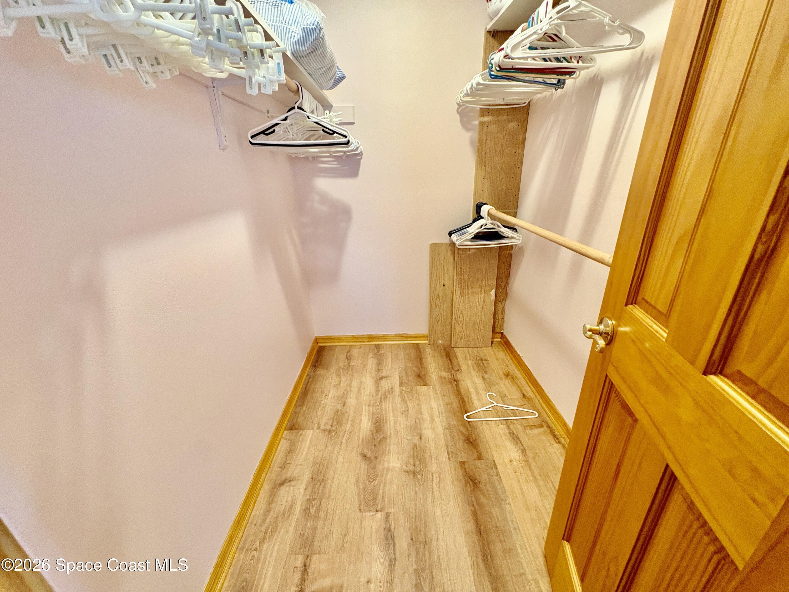 585 Crystal Mist Road Northwest Palm Bay, FL 32907 - Photo 11 of 21 a view of a balcony with wooden floor