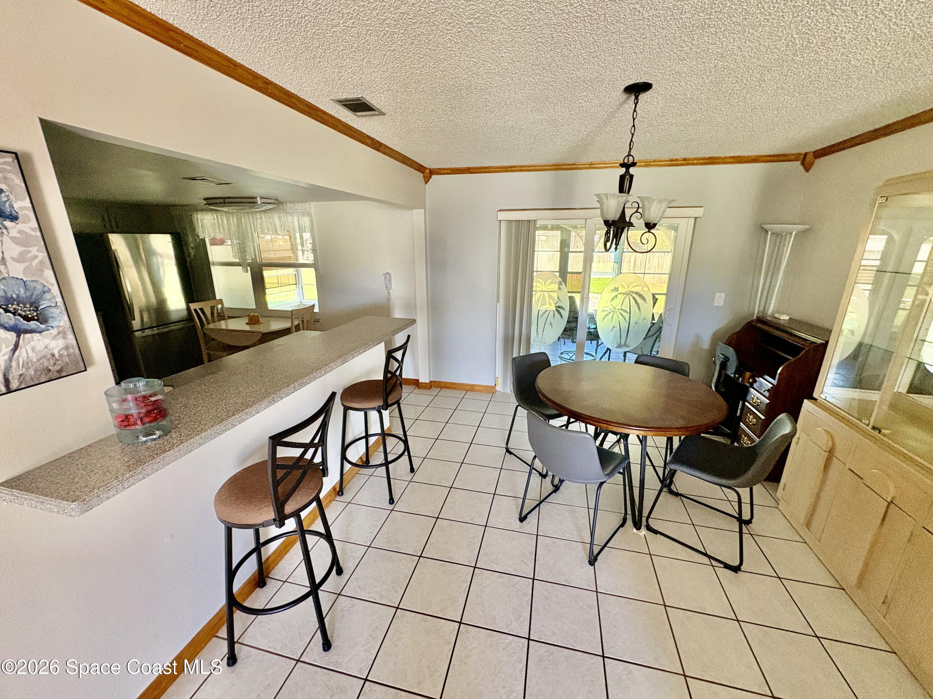 585 Crystal Mist Road Northwest Palm Bay, FL 32907 - Photo 5 of 21 a view of a livingroom with furniture and window