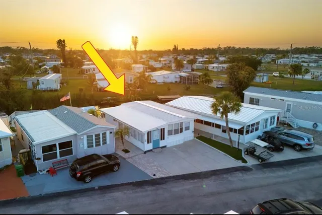 a view of a chairs and table on the wooden floor