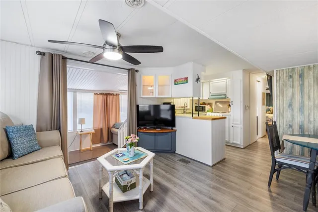 a view of a dining room with furniture and a window