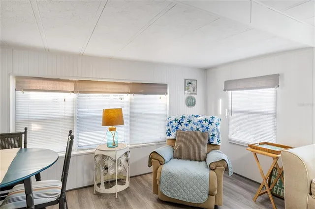 a kitchen with a sink a stove and cabinets