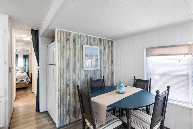 a kitchen with a stove a sink and a refrigerator