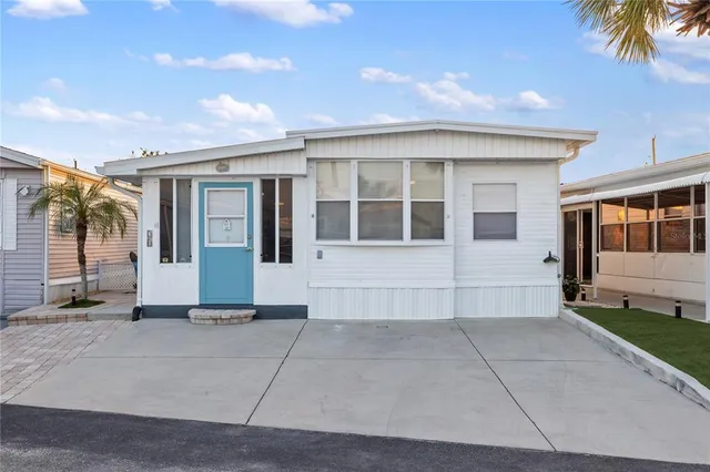 a aerial view of multiple houses with a city street