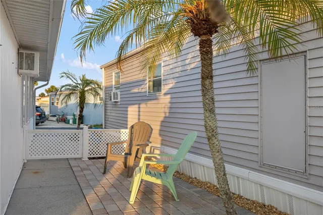 a view of a patio with table and chairs