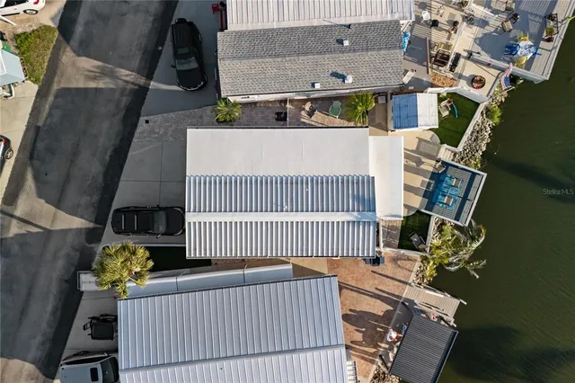 an aerial view of a residential houses with city view and lake view
