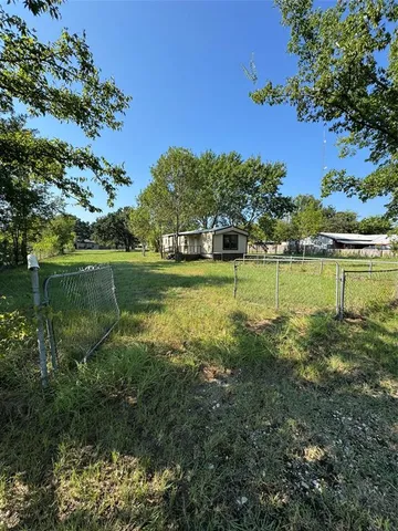 a view of a golf course with a lake view