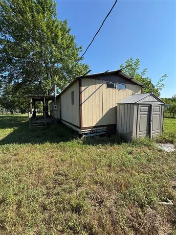 a house view with a garden space