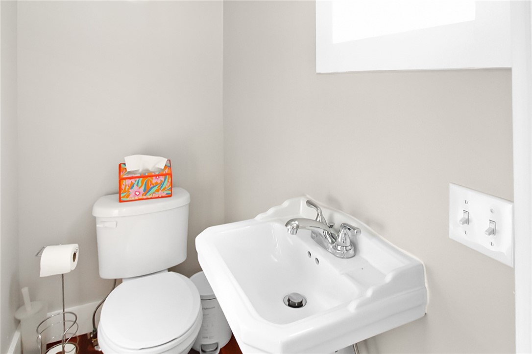 1 Conrad Court Newport, RI 02840 - Photo 12 of 20 1/2 Bathroom privately situated behind kitchen beside door to back deck and yard.