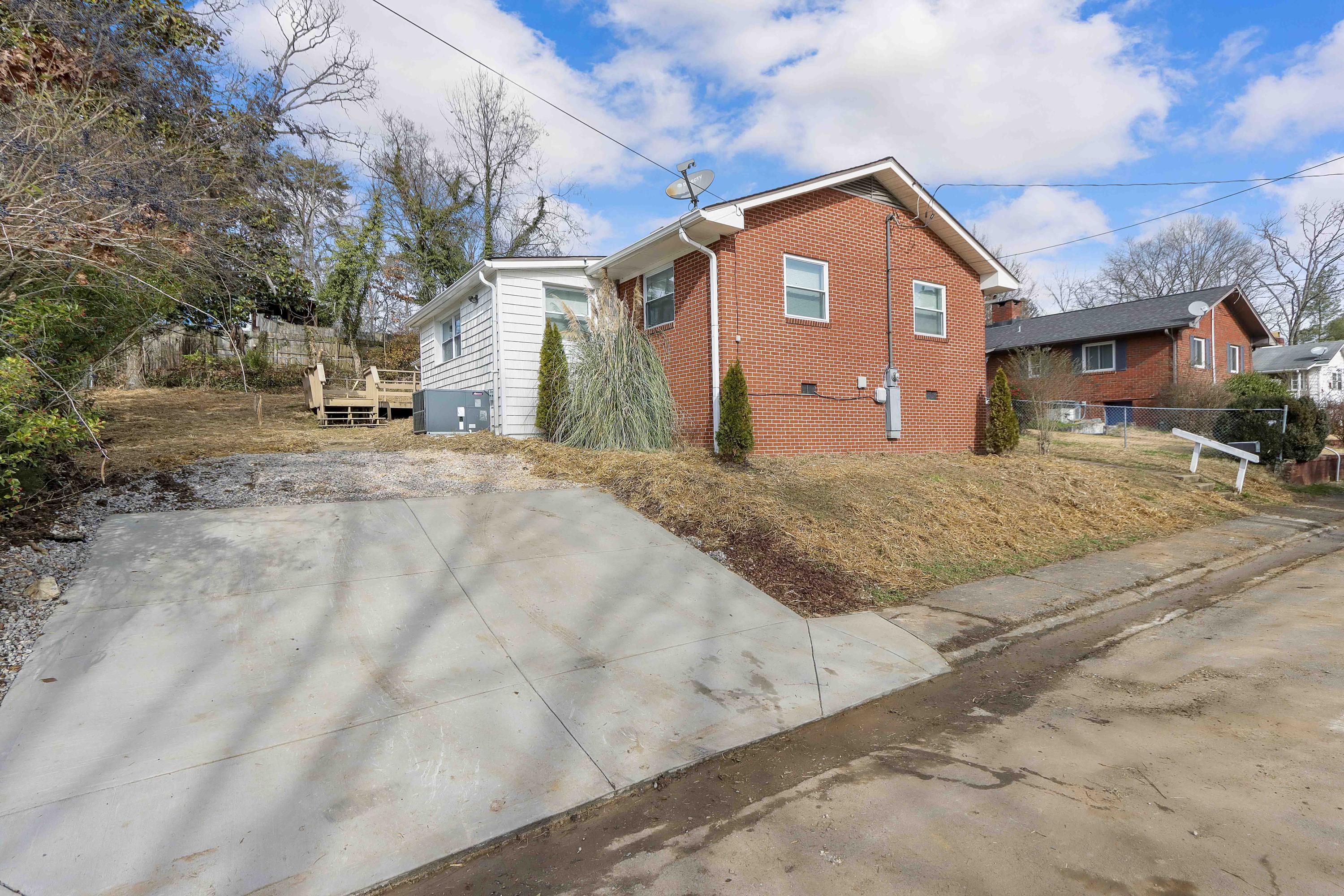 107 Tucker Road Oak Ridge, TN 37830 - Photo 3 of 22 Driveway and Rear of home