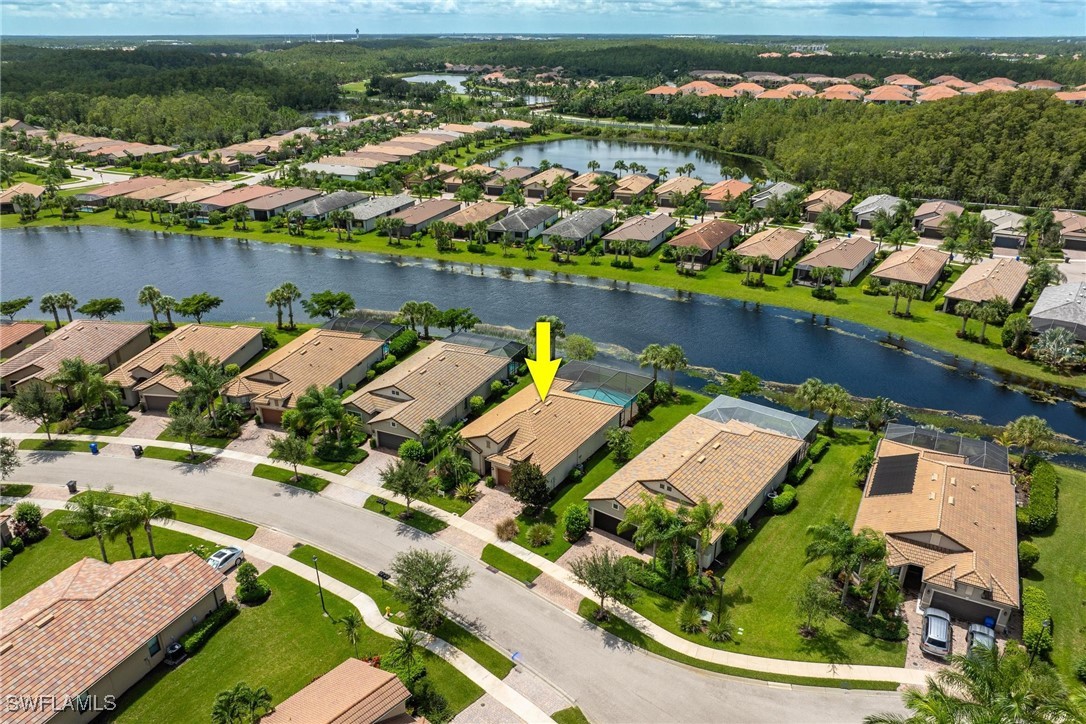 10813 Dennington Road Fort Myers, FL 33913 - Photo 34 of 42 an aerial view of a house with a lake view