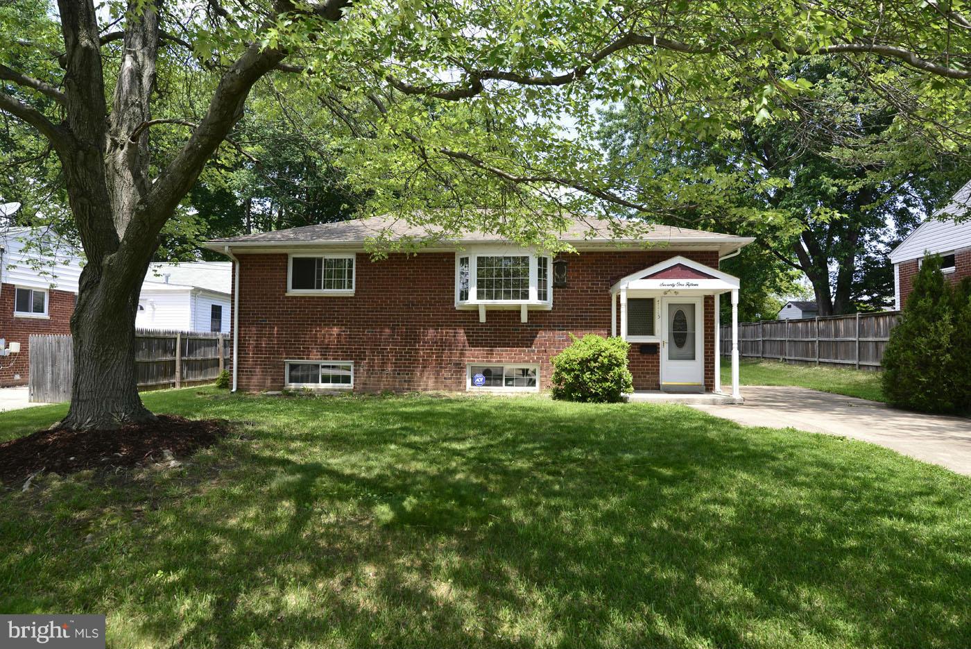 7115 Kerr Drive Springfield, VA 22150 - Photo 1 of 25 a front view of house with yard and green space
