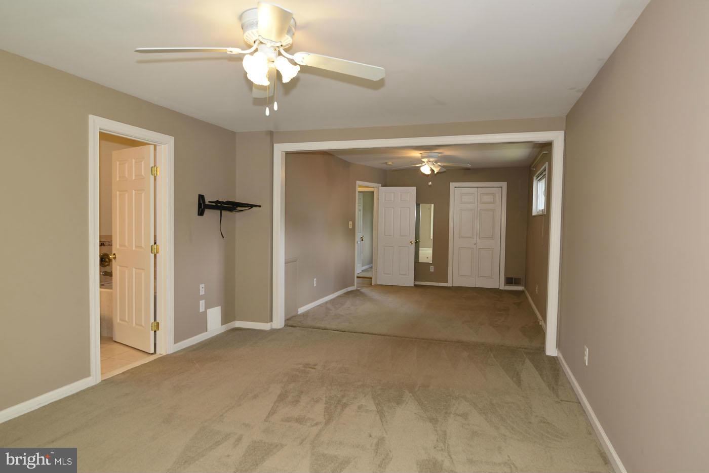 7115 Kerr Drive Springfield, VA 22150 - Photo 17 of 25 a view of a big room with chandelier fan and a livingroom