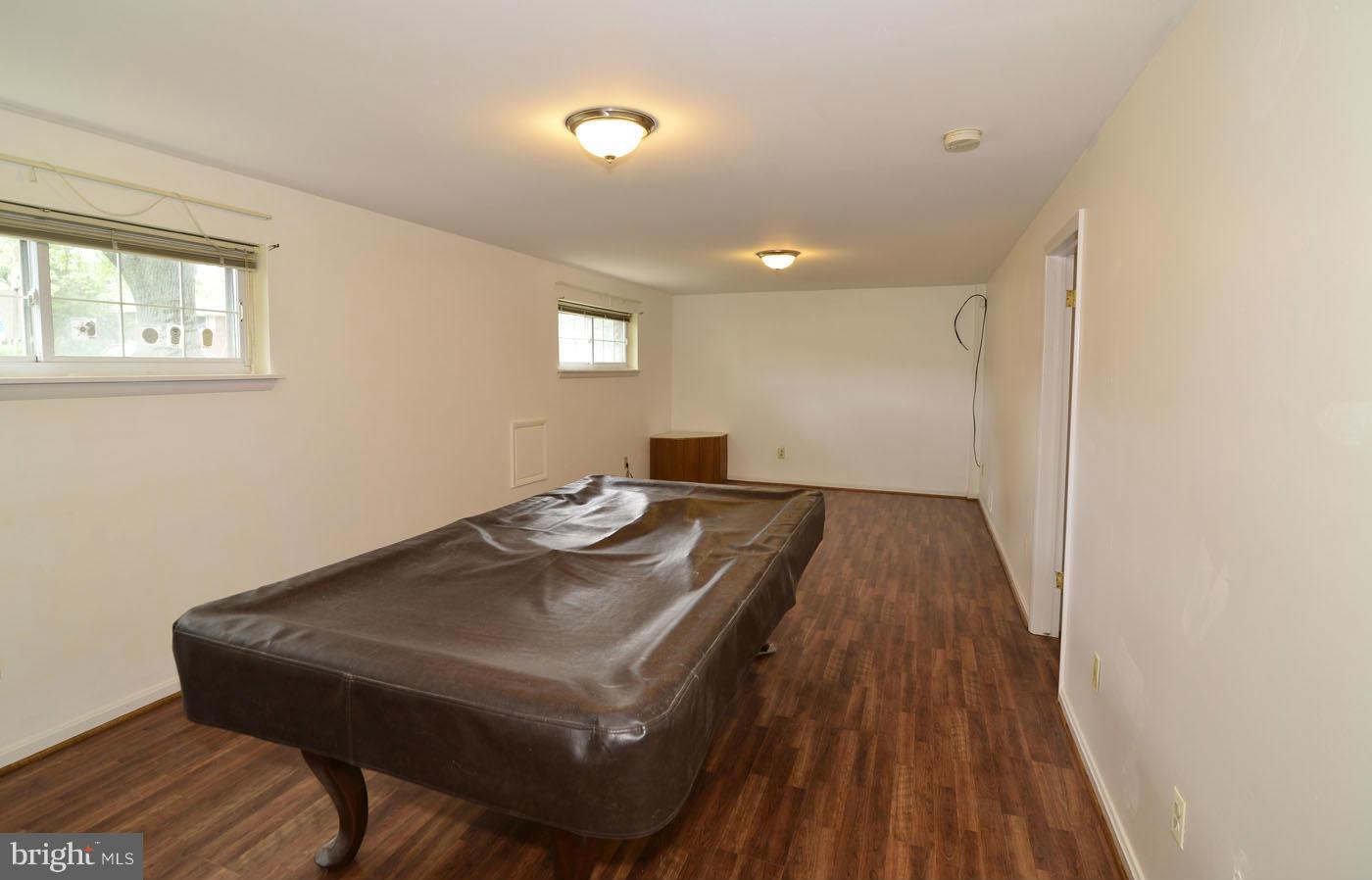 7115 Kerr Drive Springfield, VA 22150 - Photo 20 of 25 a view of a workspace with furniture and wooden floor