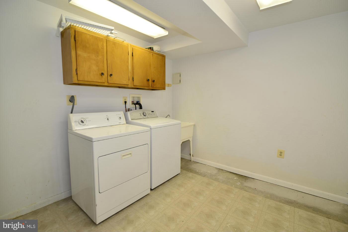 7115 Kerr Drive Springfield, VA 22150 - Photo 22 of 25 a utility room with a sink washer and dryer