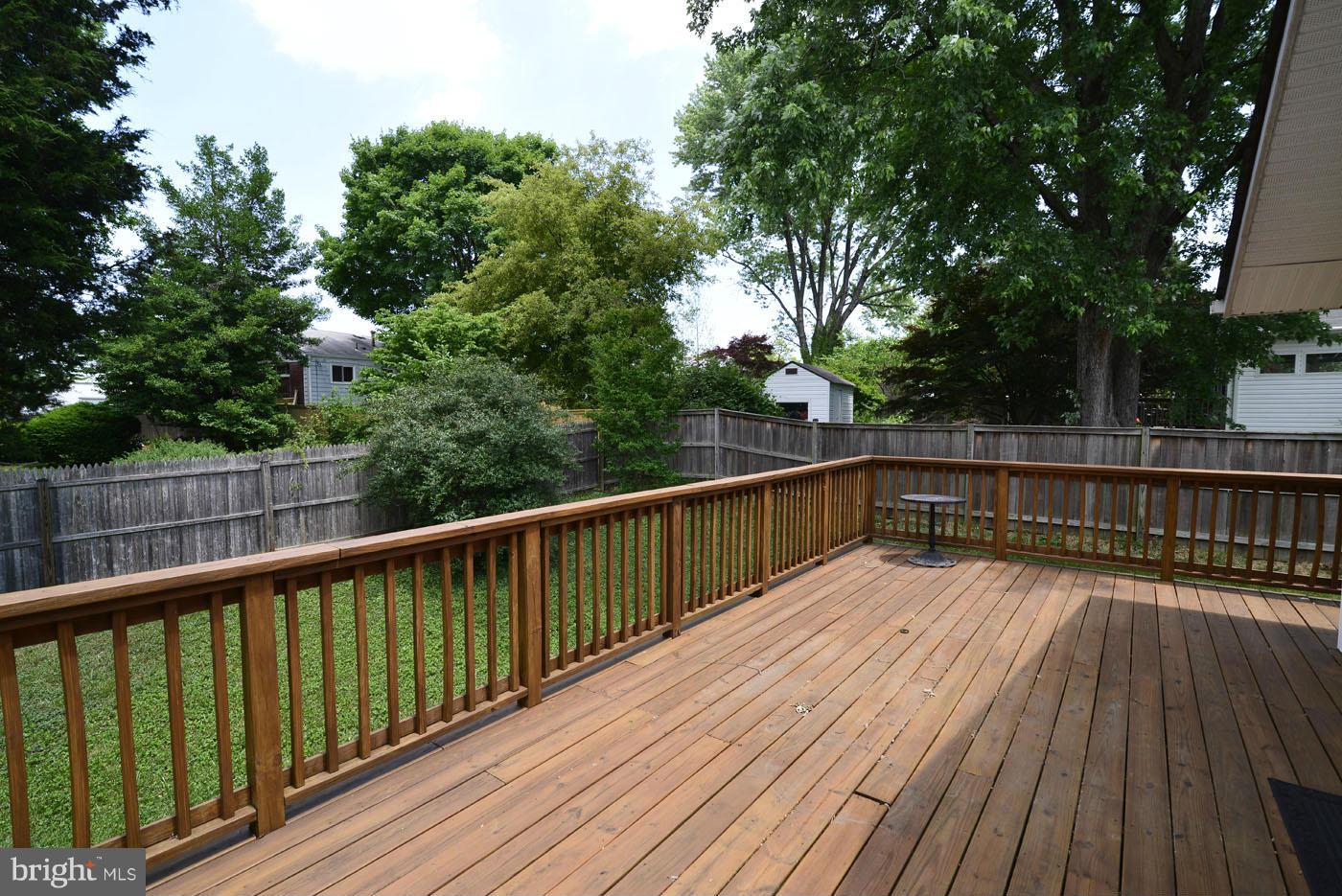 7115 Kerr Drive Springfield, VA 22150 - Photo 4 of 25 a view of balcony with wooden floor and fence