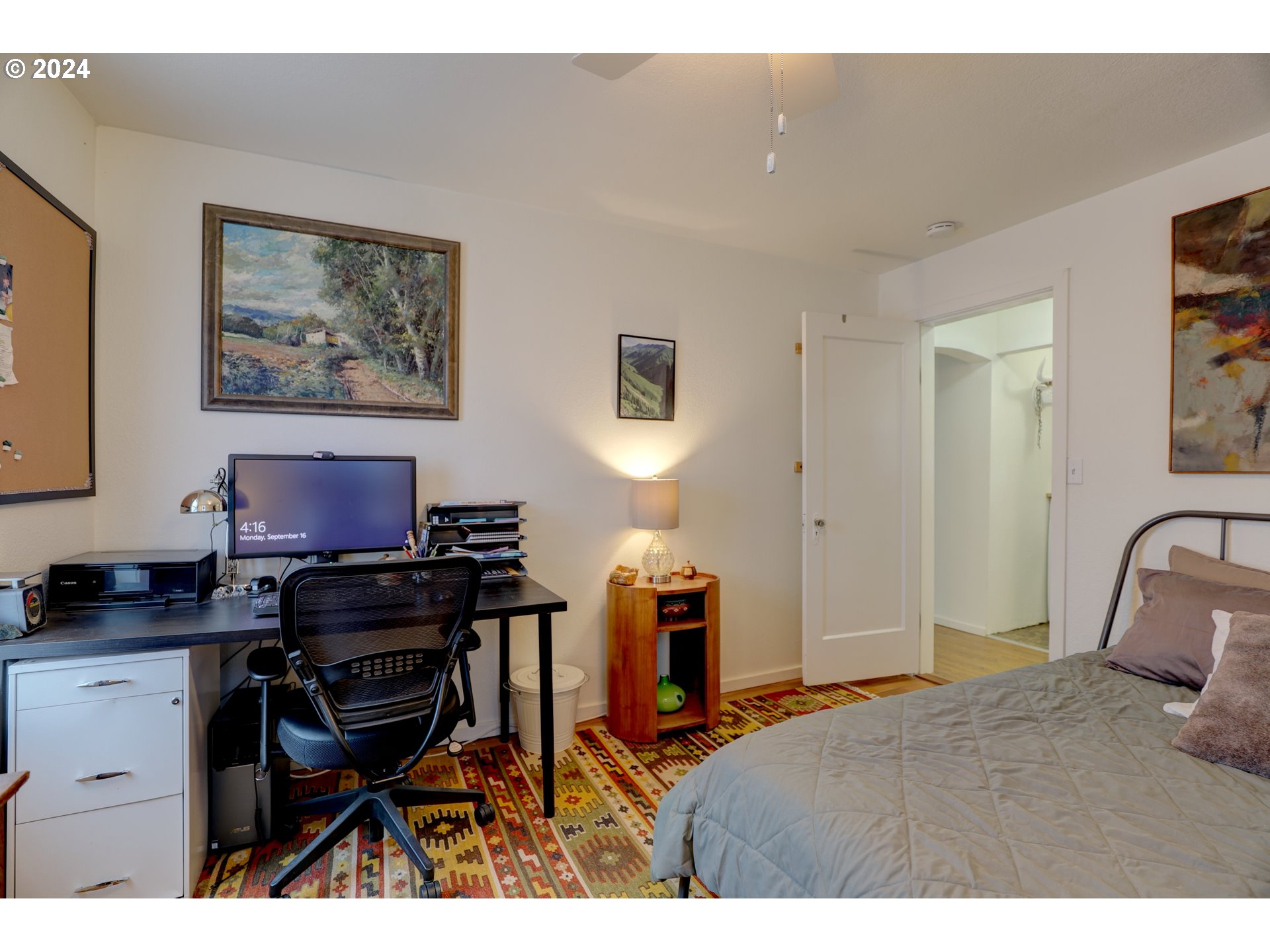 600 Forest Lane Cascade Locks, OR 97014 - Photo 28 of 48 a bedroom with a bed and a chair