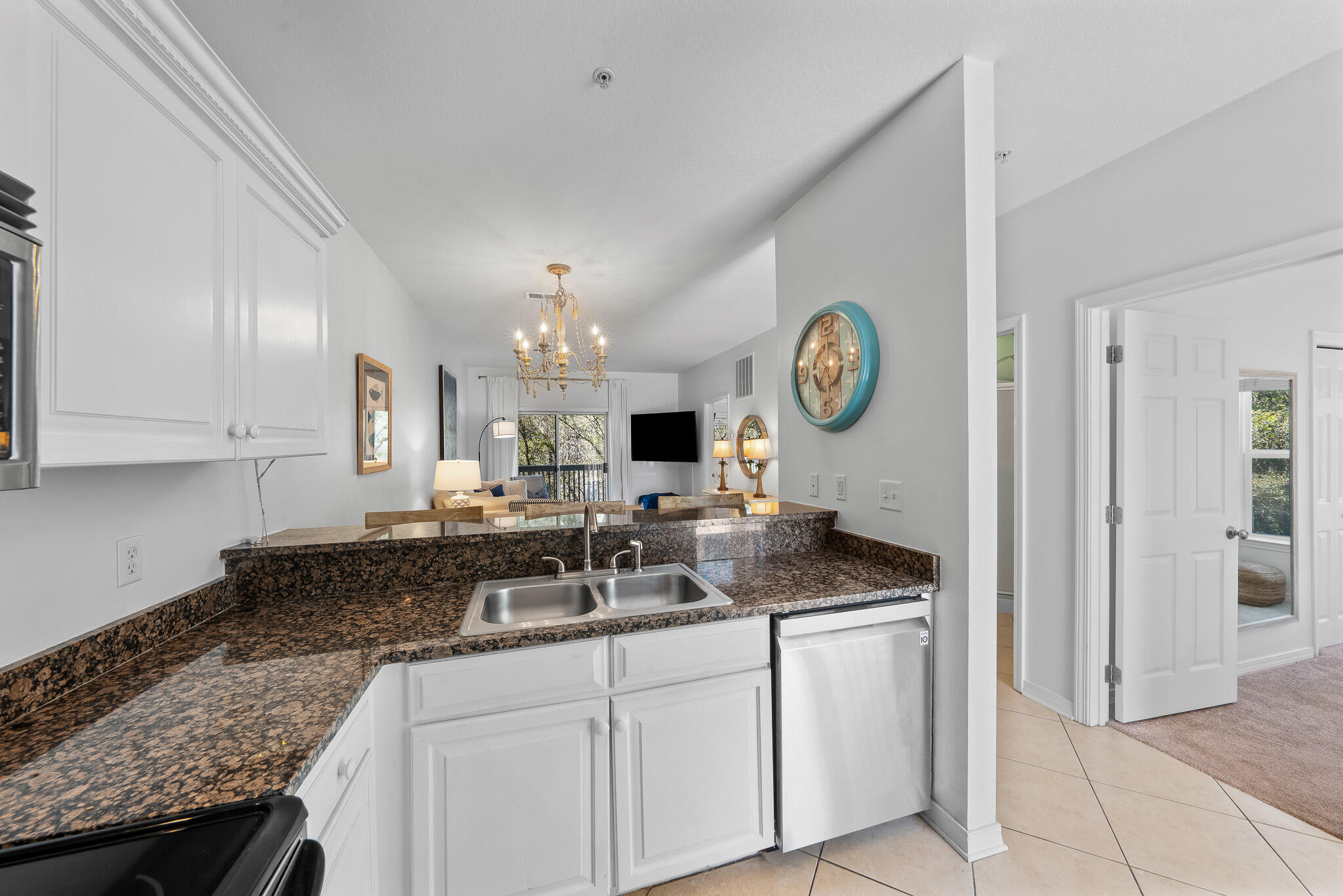 34 Heron's Watch Way, Unit 7205 Santa Rosa Beach, FL 32459 - Photo 6 of 49 a kitchen with granite countertop a sink a stove and cabinets