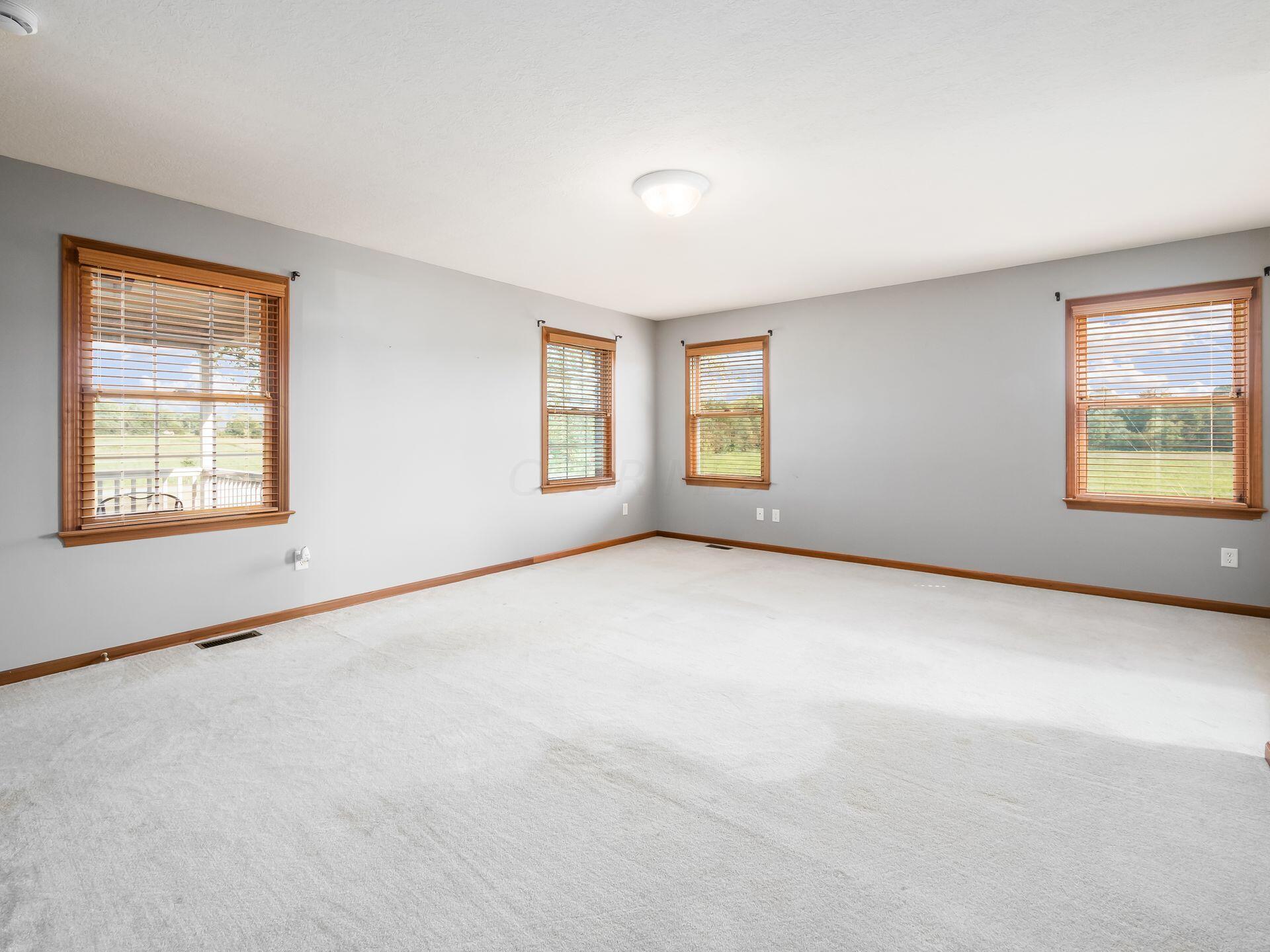 3160 Burnt Pond Road Ostrander, OH 43061 - Photo 29 of 60 1st floor primary bedroom (empty)