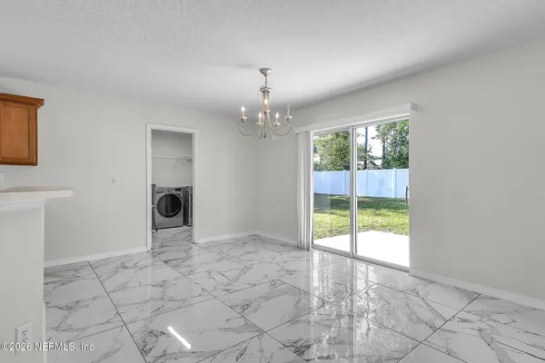 a view of a room with a large window