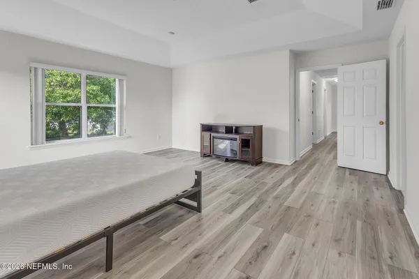 a room with a bed and a window