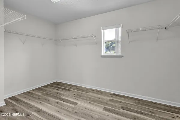 a view of a room that has a window in it
