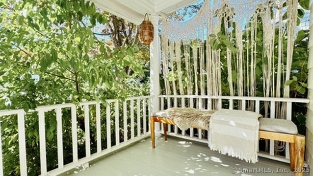 89 Richmond Hill Road New Canaan, CT 06840 - Photo 11 of 17 a view of a balcony with chairs