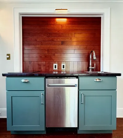 a kitchen with a sink and a cabinets