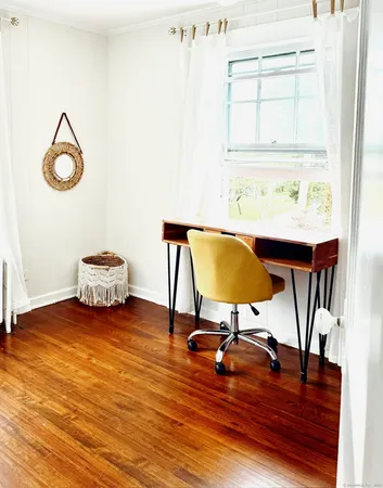 a living room with furniture and a chair