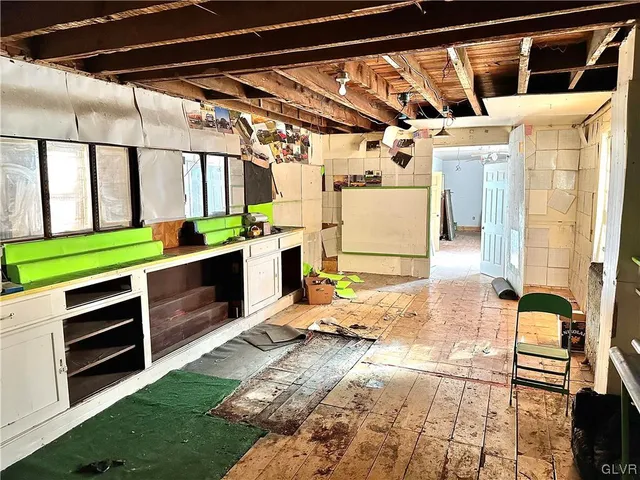 a view of a porch with a table and chairs