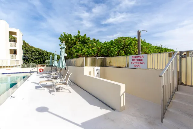 a view of a terrace with couches and sky view
