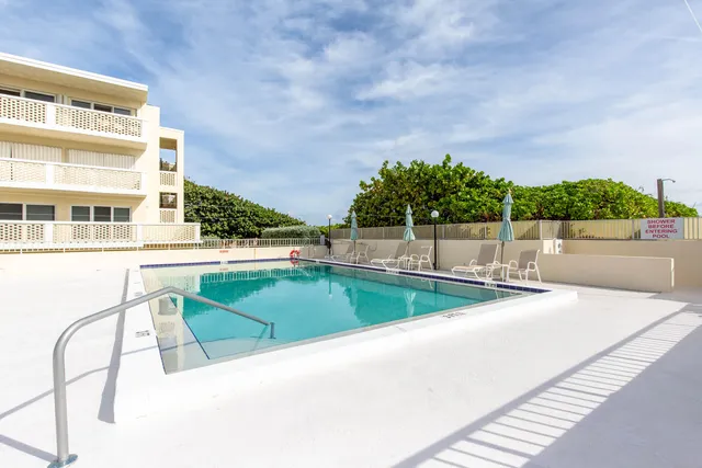 a view of a swimming pool with a terrace