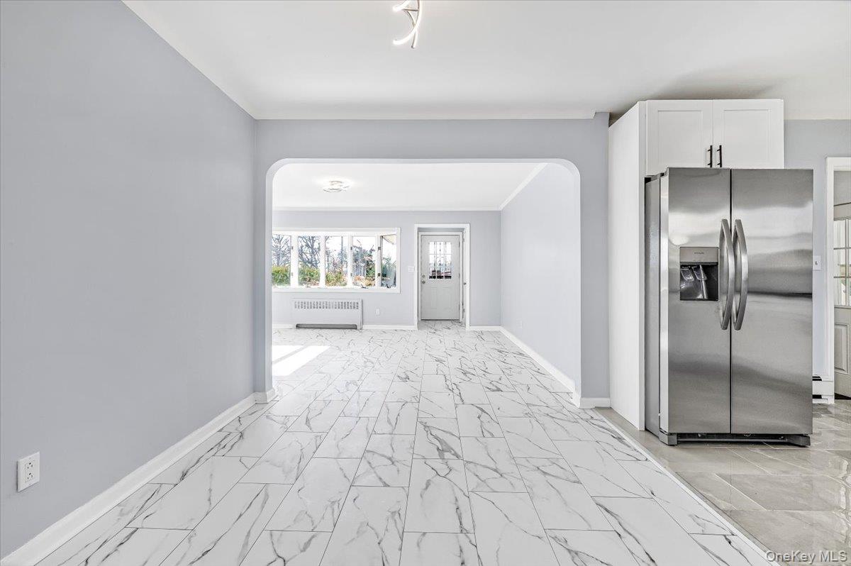 95 Harold Avenue Hempstead, NY 11550 - Photo 12 of 29 a view of a kitchen with a refrigerator