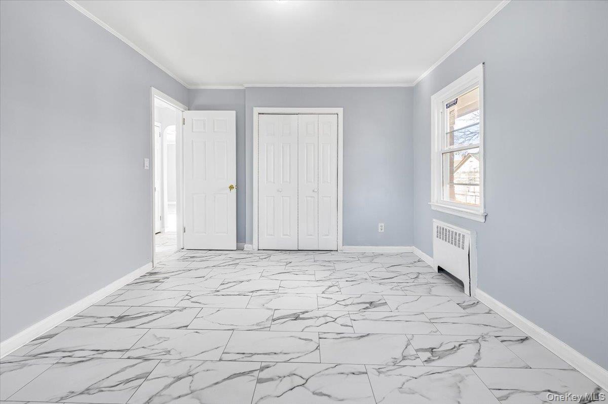 95 Harold Avenue Hempstead, NY 11550 - Photo 17 of 29 a view of an empty room and window