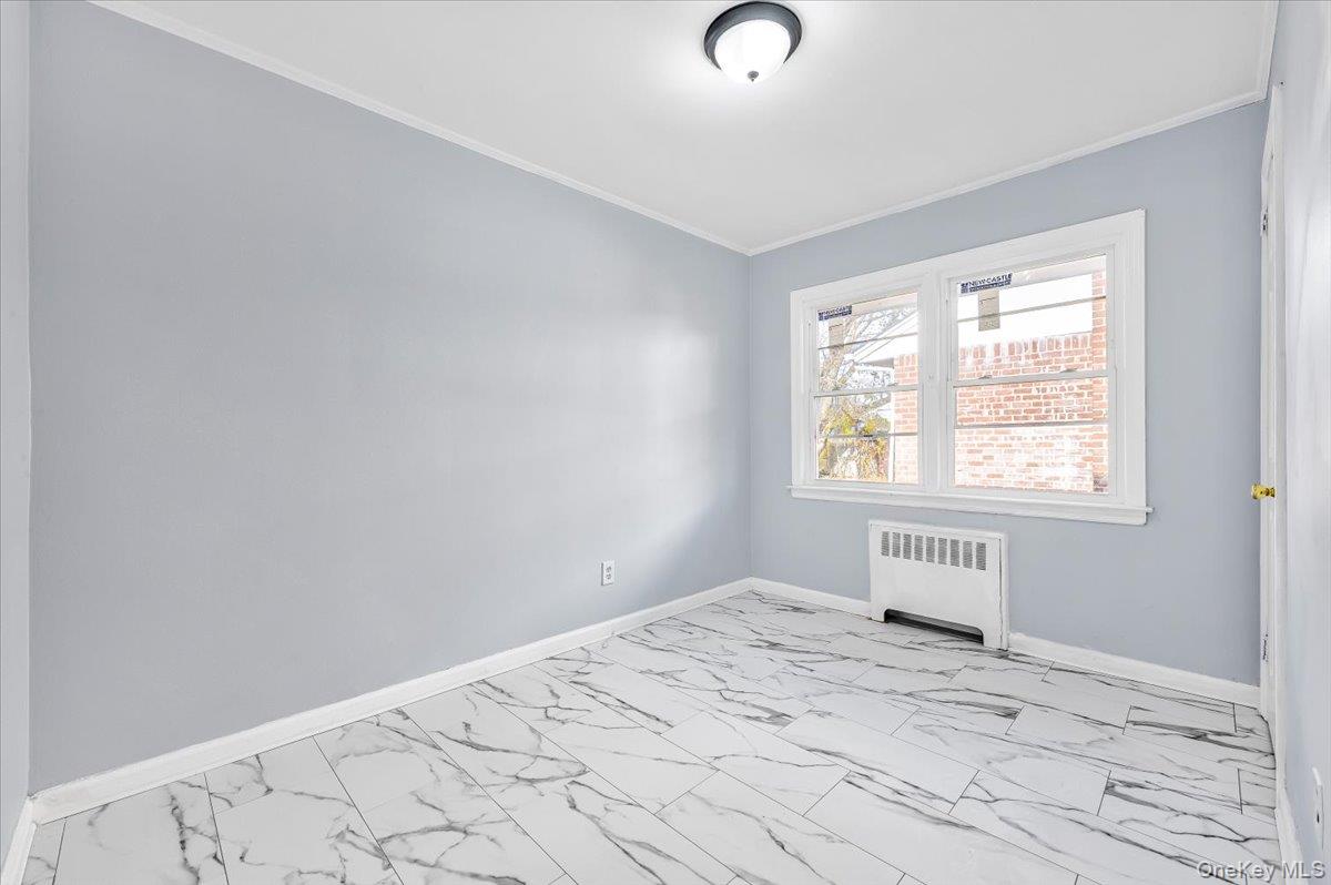 95 Harold Avenue Hempstead, NY 11550 - Photo 18 of 29 an empty room with a window