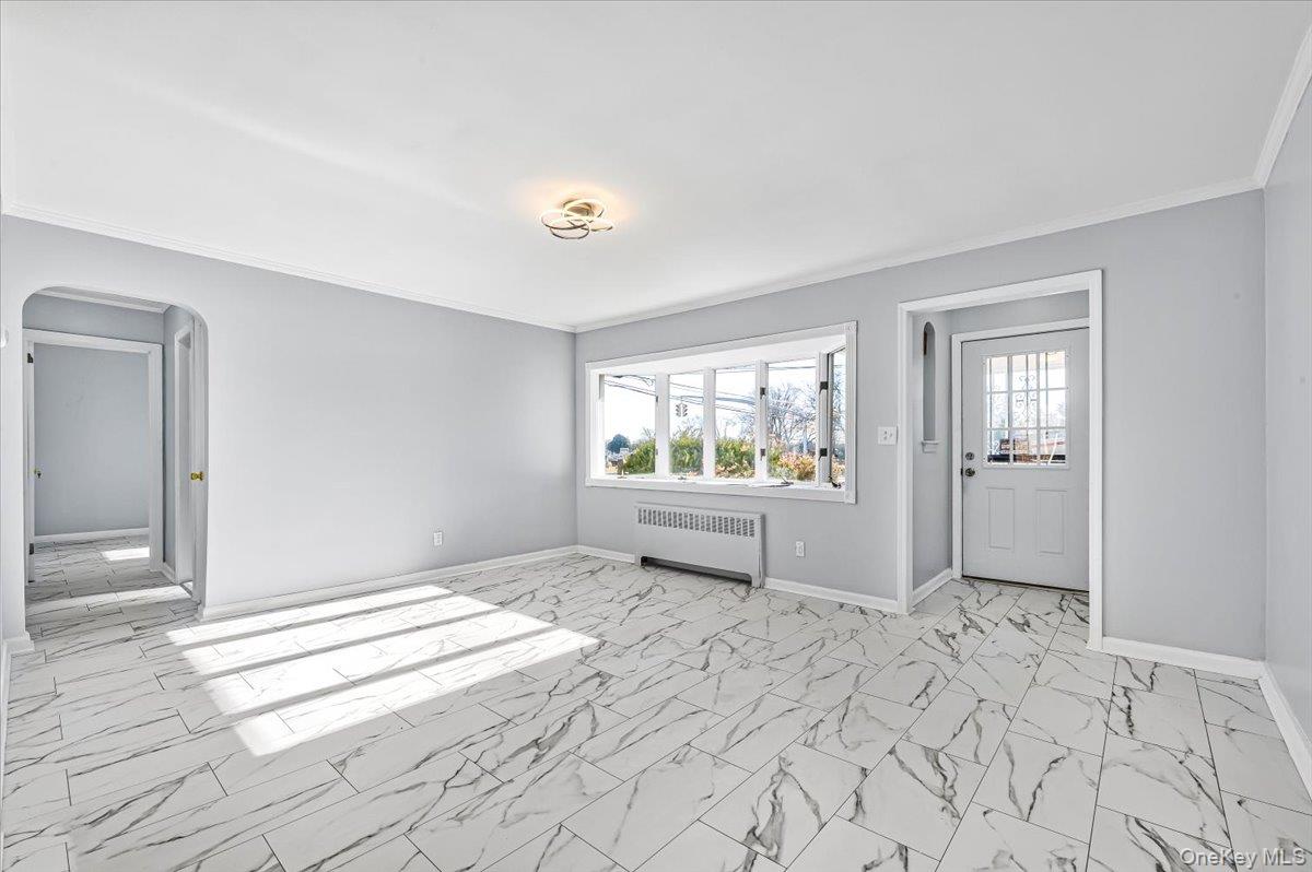 95 Harold Avenue Hempstead, NY 11550 - Photo 5 of 29 a view of an empty room and window