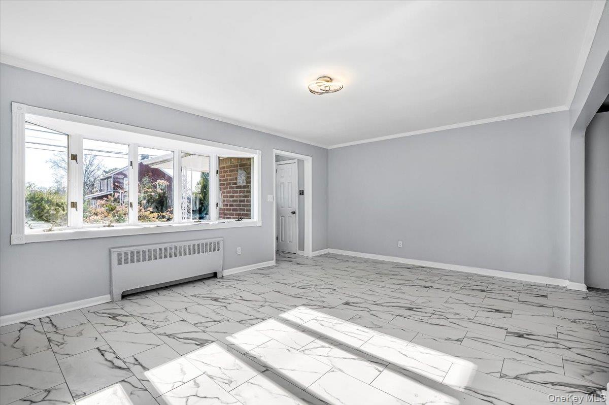 95 Harold Avenue Hempstead, NY 11550 - Photo 8 of 29 a view of an empty room with a window