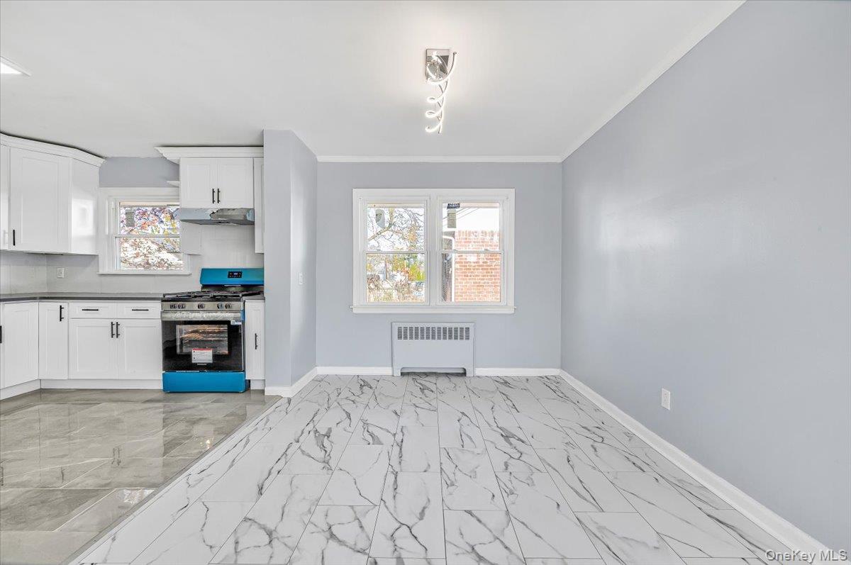 95 Harold Avenue Hempstead, NY 11550 - Photo 9 of 29 a bedroom with a bed and a window